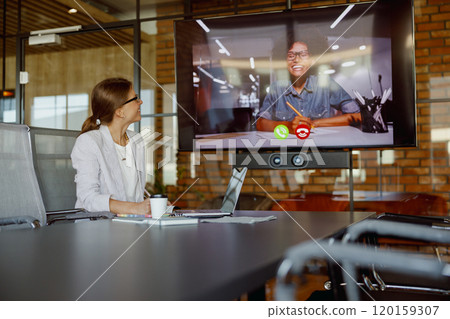 Video conferences in modern offices enhance collaboration and productivity among teams Video conferences in modern offices enhance collaboration and productivity among teams 120159307