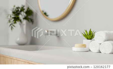 A close-up of a minimal white and clean bathroom counter in a minimalist bathroom. 120162177
