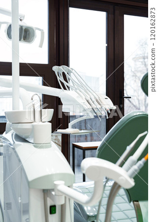 Modern dental clinic interior with advanced equipment 120162873