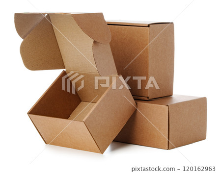 Stacked brown cardboard boxes in various sizes arranged on a white background Stacked brown cardboard boxes in various sizes arranged on a white background 120162963