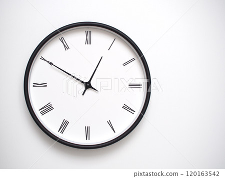 Clock Showing 12.50 or 11.50 with Roman Numerals. Simple Round Clock for Concepts of Time Management and Scheduling. 120163542