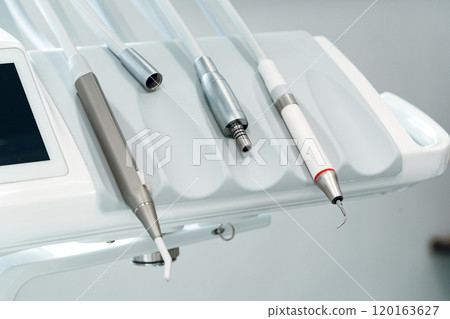 Dental equipment setup in a modern clinic with tools 120163627