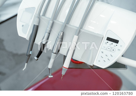 Dental equipment setup in a modern clinic with tools 120163780