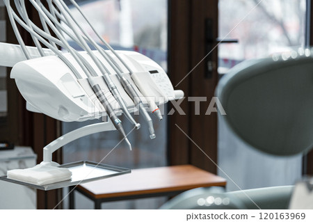 Dental equipment setup in a modern clinic with tools 120163969