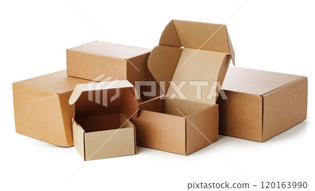 Stacked brown cardboard boxes in various sizes arranged on a white background 120163990