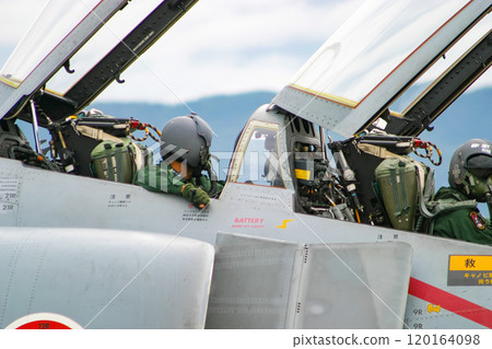 A pilot enters the cockpit of an Air Self-Defense Force fighter jet, the F-4EJ Kai. A pilot enters the cockpit of an Air Self-Defense Force fighter jet, the F-4EJ Kai. 120164098