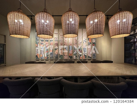 Large meeting table and chairs with large wood lamp 120164384