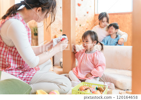 Children playing at a nursery school, kindergarten, daycare center, or daycare center and childcare workers and babysitters 120164658