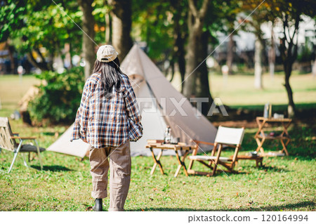 Young woman taking a break at holiday camp 120164994