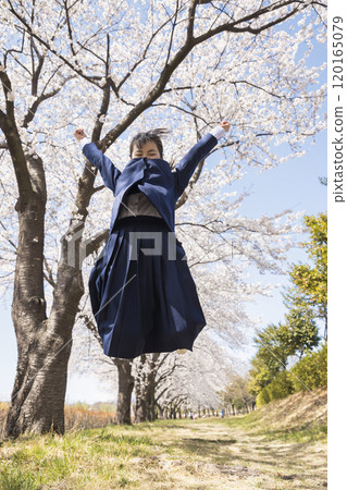 New junior high school students jumping in front of cherry blossoms, elementary school graduation, enrollment image New junior high school students jumping in front of cherry blossoms, elementary school graduation, enrollment image 120165079