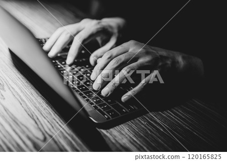 Man using a laptop (monochrome) Man using a laptop (monochrome) 120165825