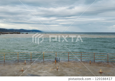 Railings, a barrier on the seashore. The Black Sea. Railings, a barrier on the seashore. The Black Sea. 120166417