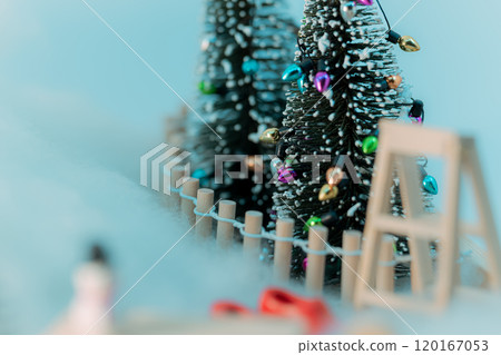 Snowy Christmas tree decorated with colorful lights Snowy Christmas tree decorated with colorful lights 120167053