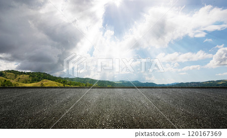 Asphalt street with mountain range with blue sky and clouds in the background Asphalt street with mountain range with blue sky and clouds in the background 120167369