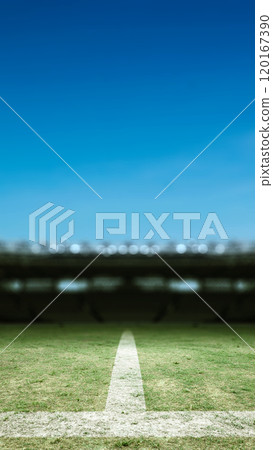 Empty football stadium with green field and blur spotlights. The field is ready for a game Empty football stadium with green field and blur spotlights. The field is ready for a game 120167390
