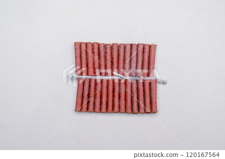 Red fire crackers string isolated over white background Red fire crackers string isolated over white background 120167564