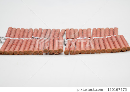 Red fire crackers string isolated over white background 120167573