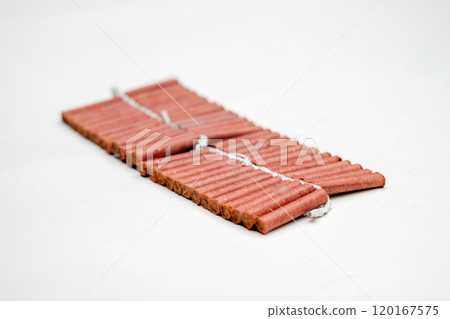 Red fire crackers string isolated over white background Red fire crackers string isolated over white background 120167575