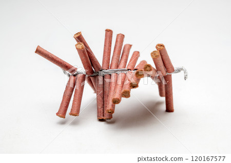 Red fire crackers string isolated over white background Red fire crackers string isolated over white background 120167577