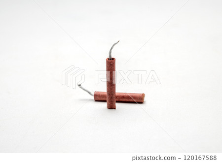 Red fire crackers isolated over white background Red fire crackers isolated over white background 120167588