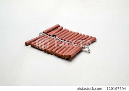 Red fire crackers string isolated over white background 120167594