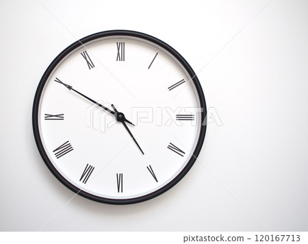 Clock Showing 16.50 or 04.50 with Roman Numerals. Simple Round Clock for Concepts of Time Management and Scheduling. 120167713