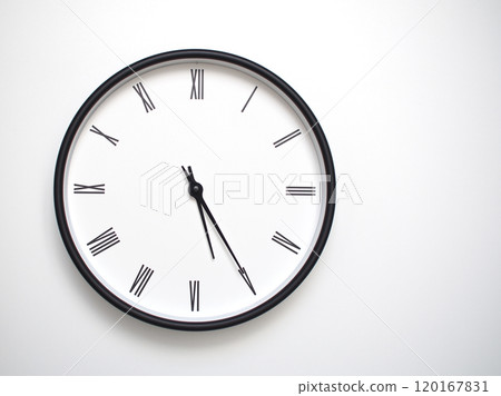 Clock Showing 17.25 or 05.25 with Roman Numerals. Simple Round Clock for Concepts of Time Management and Scheduling. Clock Showing 17.25 or 05.25 with Roman Numerals. Simple Round Clock for Concepts of Time Management and Scheduling. 120167831