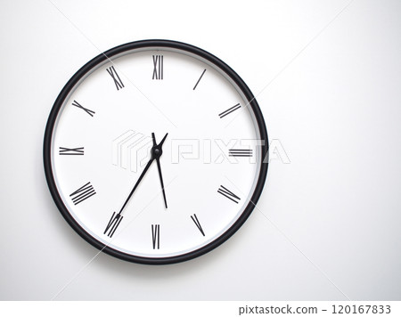 Clock Showing 17.35 or 05.35 with Roman Numerals. Simple Round Clock for Concepts of Time Management and Scheduling. 120167833
