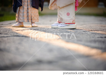 Shichigosan sandals illuminated by the setting sun 120168681