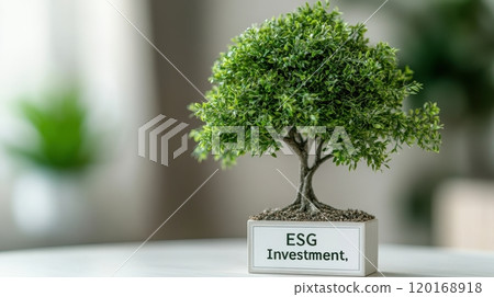 A small decorative tree symbolizing ESG investment, placed on a table with a blurred background, highlighting sustainable finance and environmental responsibility. 120168918