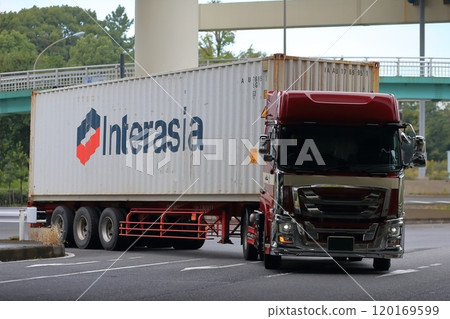 A trailer truck turning right at an intersection 120169599