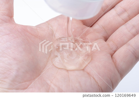 Close-up of a clear gel on the palm of a hand Close-up of a clear gel on the palm of a hand 120169649