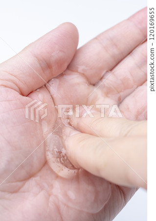 Close-up of a clear gel on the palm of a hand Close-up of a clear gel on the palm of a hand 120169655