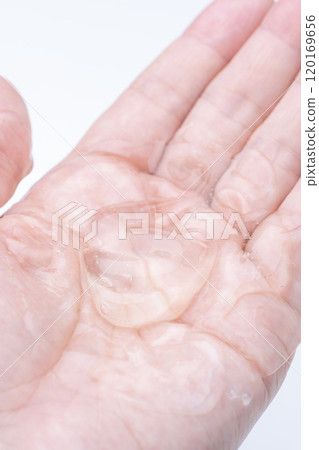 Close-up of a clear gel on the palm of a hand Close-up of a clear gel on the palm of a hand 120169656