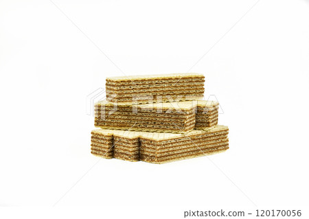 On a light background there are several strips of waffle dessert with chocolate filling 120170056