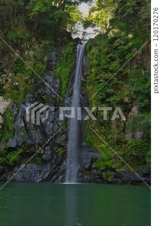 A waterfall with a secretly captivating emerald green A waterfall with a secretly captivating emerald green 120170276
