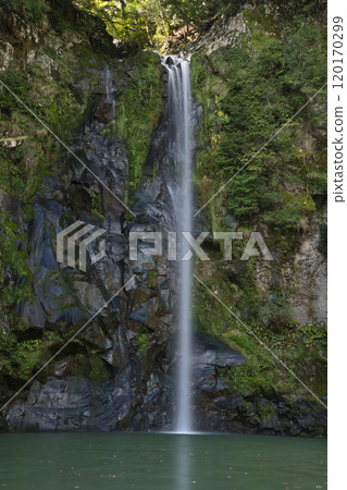 A waterfall with a secretly captivating emerald green A waterfall with a secretly captivating emerald green 120170299