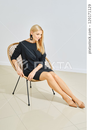 Cute and dreamy woman in little black dress posing Cute and dreamy woman in little black dress posing 120171129