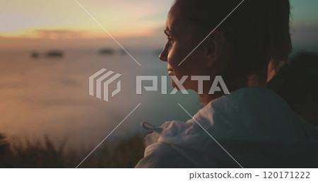 Woman enjoying a peaceful sunset in thailand, surrounded by nature's beauty. Perfect for summer vacations and inspiring relaxation 120171222