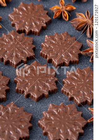 Chocolate candies in the shape of snowflakes. Chocolate candies in the shape of snowflakes. 120171627