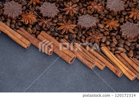 Food background. Coffee beans, cinnamon sticks, anise stars and chocolate candies. 120172314