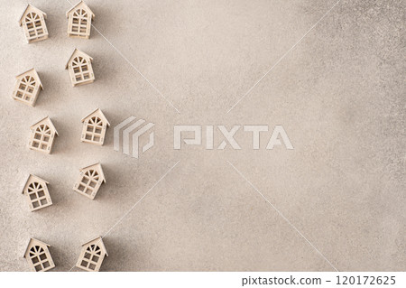 Wooden toy houses. Gray background Wooden toy houses. Gray background 120172625