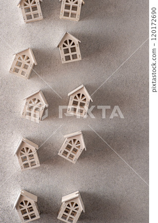 Wooden toy houses. Gray background Wooden toy houses. Gray background 120172690