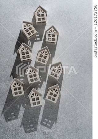 Wooden toy houses. Gray background 120172756