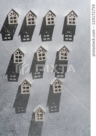 Wooden toy houses. Gray background 120172759