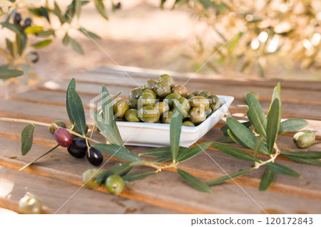Olives on table in an olive grove 120172843