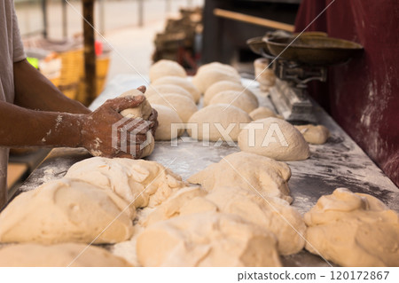 Process of making bread. dough kneading 120172867