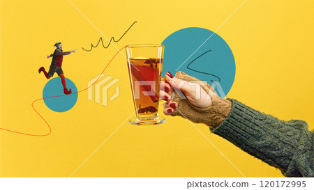Glass of holiday tea with citrus, and cinnamon with little male elf running towards warm drink on brought yellow background. Contemporary art collage. 120172995