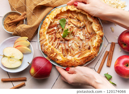 Apple galette preparation with fresh ingredients and spices on a kitchen countertop Apple galette preparation with fresh ingredients and spices on a kitchen countertop 120174066