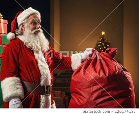 Santa Claus with a Gift Sack of Presents Left Under the Christmas Tree 120174153